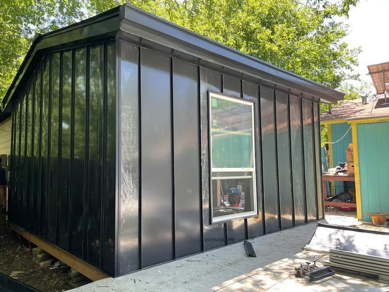 Black standing seam metal wall panels for Roof Inspection in Centerville